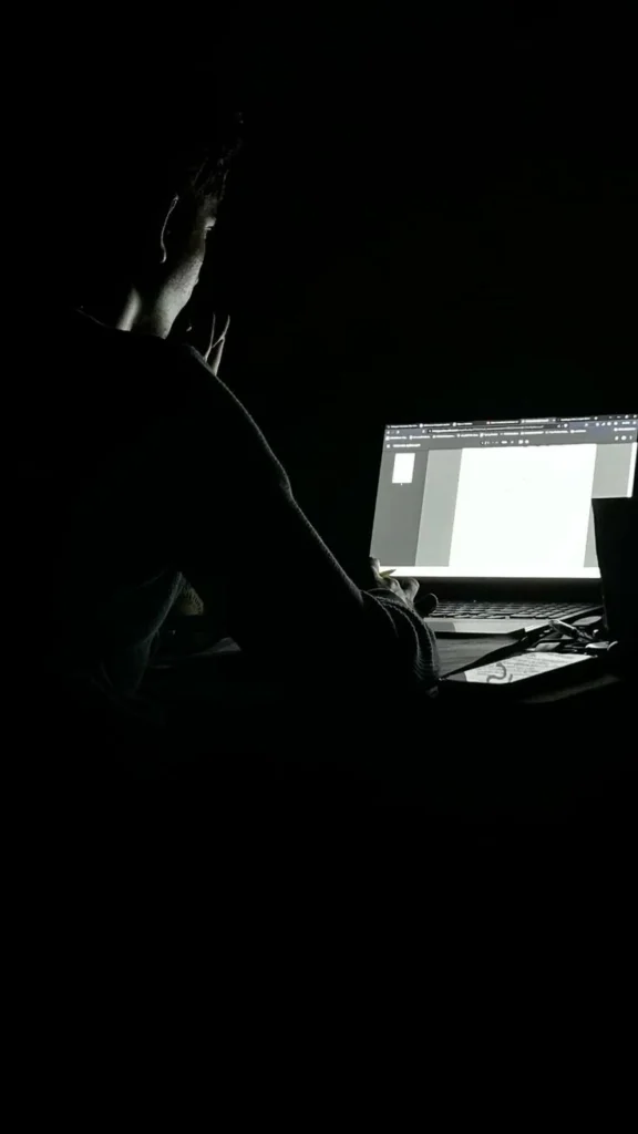 Best digital marketing analyst in Wayanad working late on SEO strategy, content planning, and digital marketing projects using a laptop.